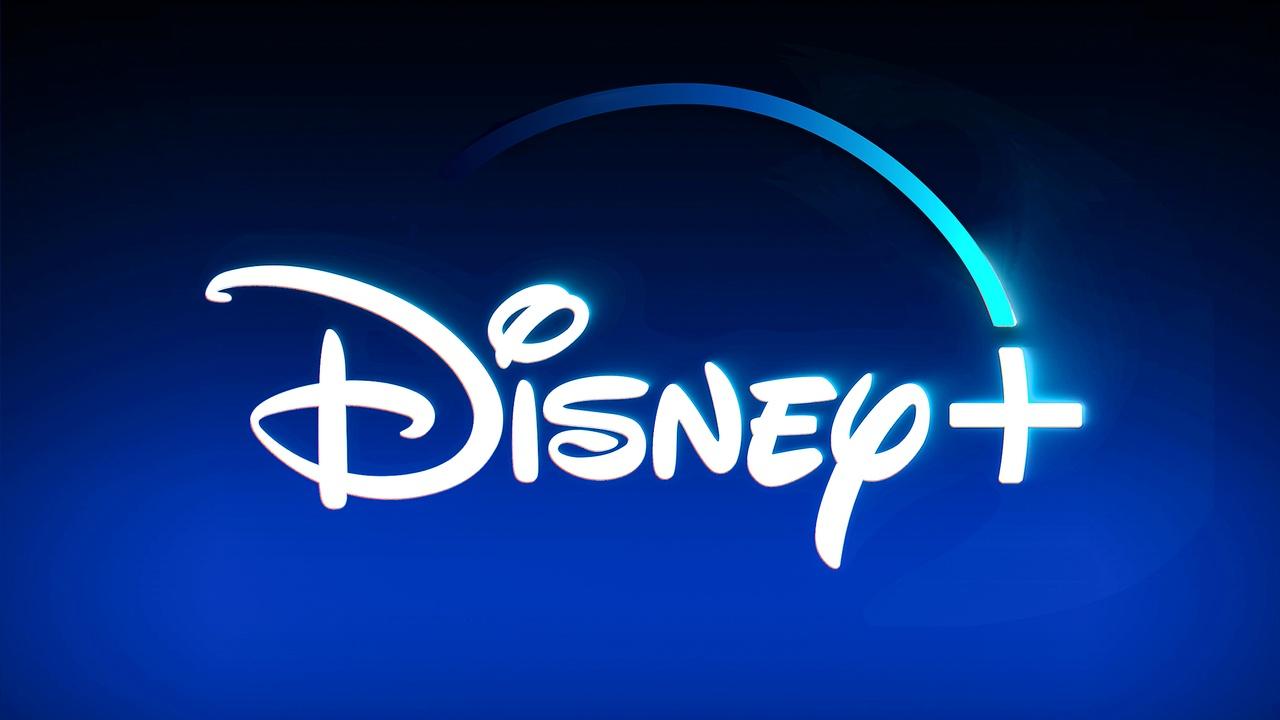 Disney Plus logo on blue blurred background.