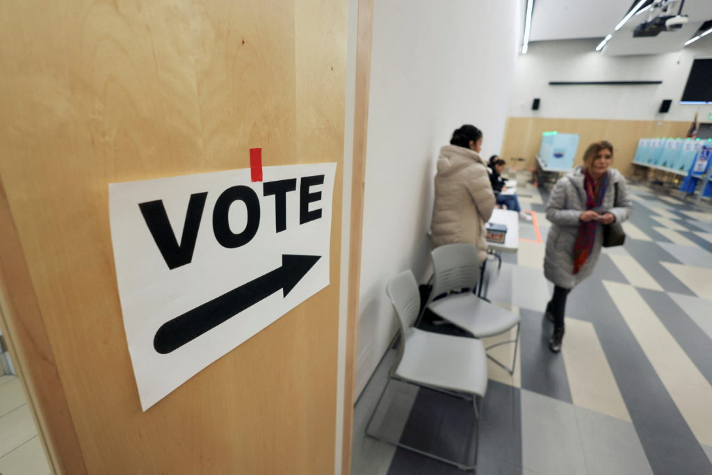 Voters line up to cast their ballots in the Nevada’s presidential primary election